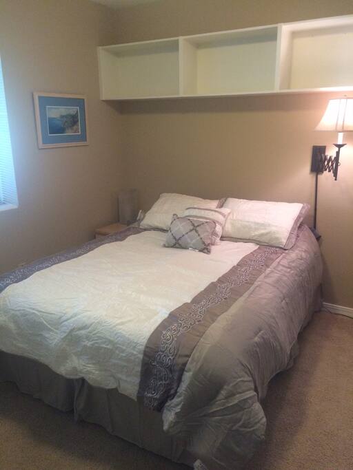 Queen bed. Bedroom 1. Memory foam mattress topper.