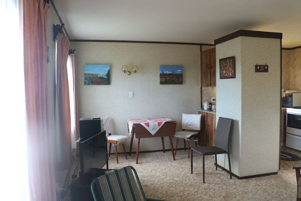 Dinning area with extra chairs.TV plus DVD Player.