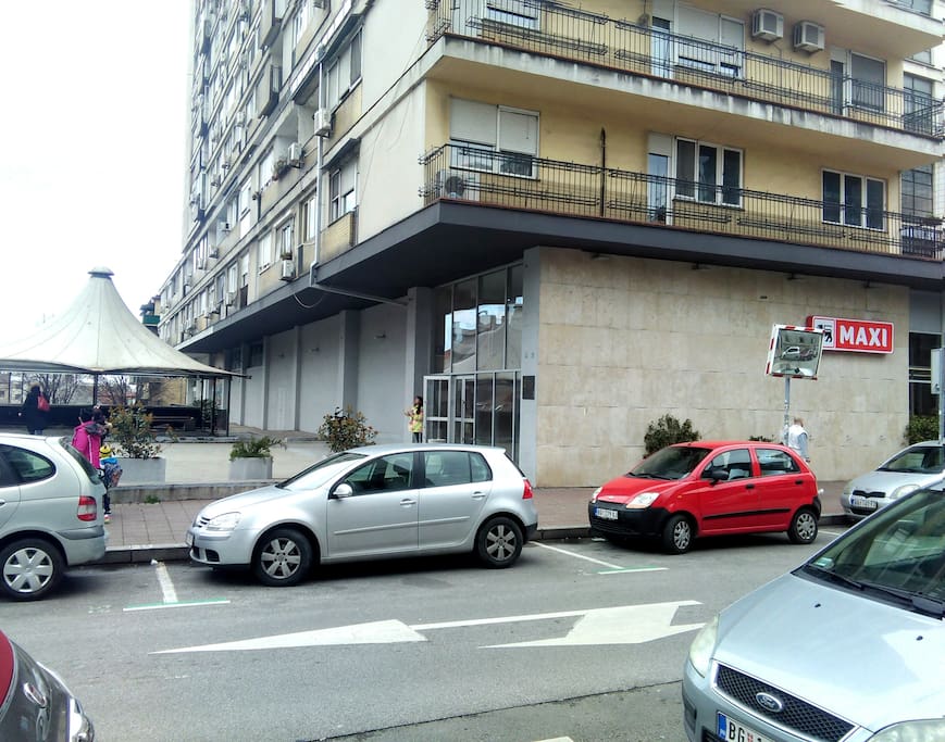 So, you arrived. Welcome! This is the building waiting for you. The biggest building in the strict center, with electronic doors and cameras, and the big supermarket in the bottom. We will be waiting on the entrance, in the case we don't wait for you somewhere in the city.