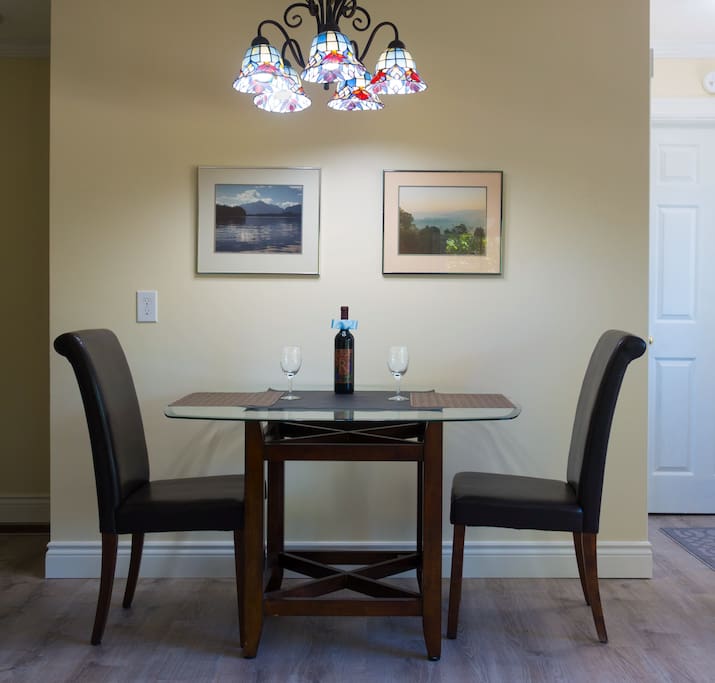 The dining area. We provide a bottle of red wine--if you don't like wine, let us know and we won't put it out. Two more chairs are stored in the office.