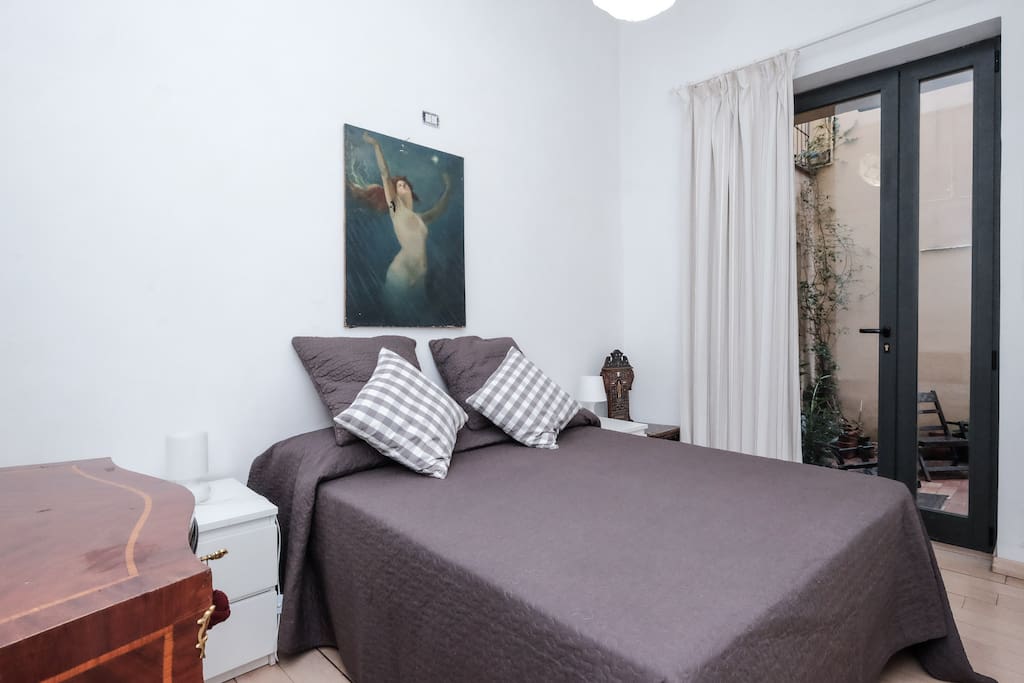 The master bedroom with private access to the patio.