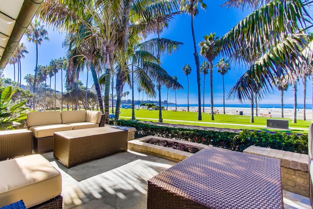 Oceanfront view patio at La Jolla Shores with lounge seating and fire pit