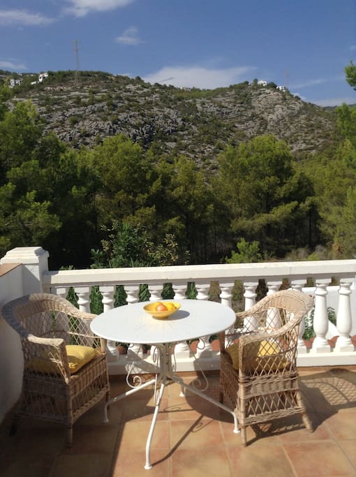 Secluded balcony at the back of the house overlooking the hills beyond