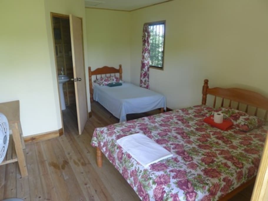 Room with private bathroom, fan and AC
