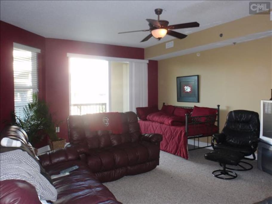 Living room with TV. Couches recline.