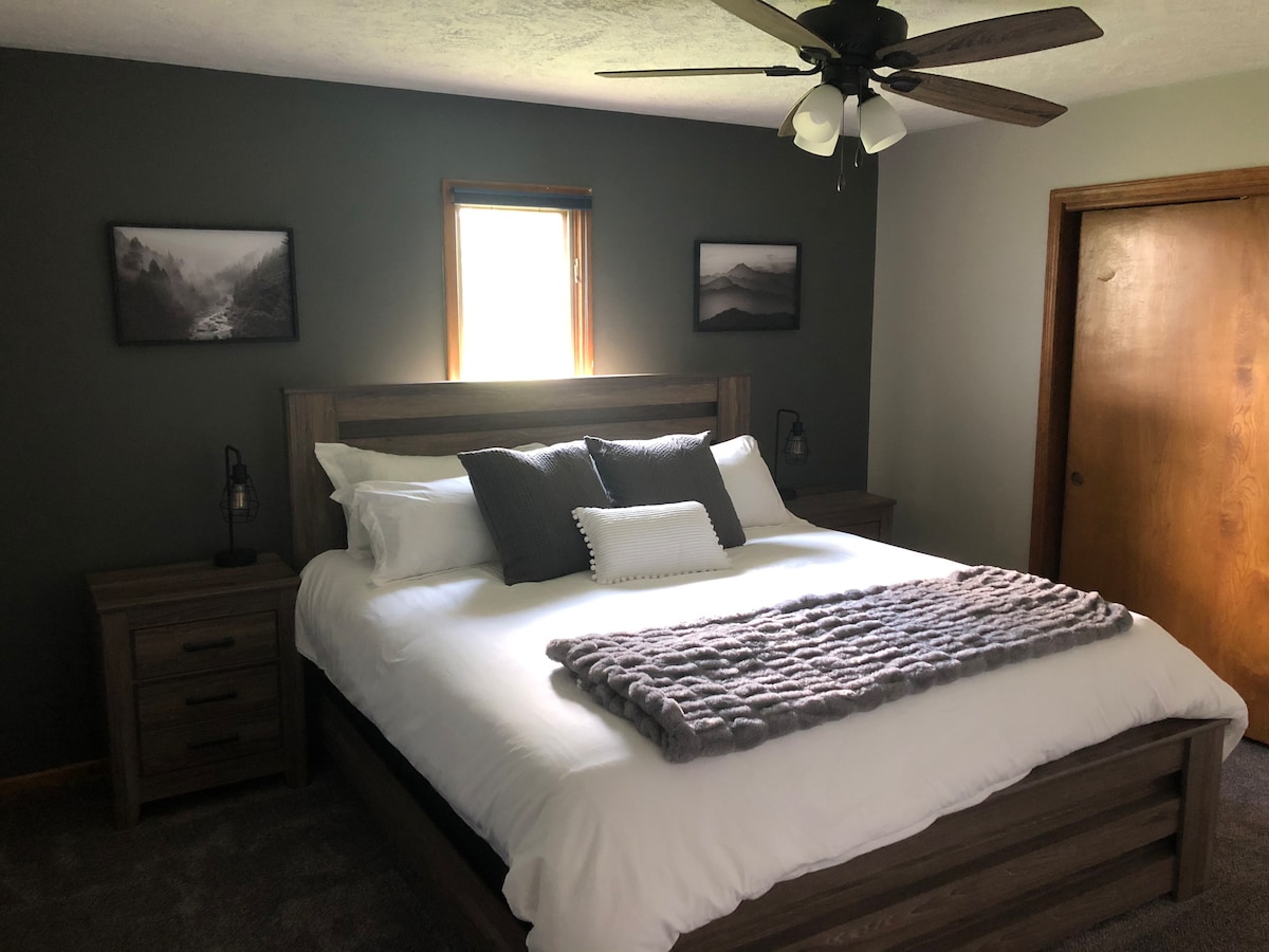 Basement 4 - King Bed located in the basement.  Has a huge closet, 2 night stands with lamps, ceiling fan, and an extra blanket!