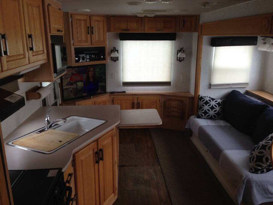 Spacious living area includes couch that folds to a double bed.