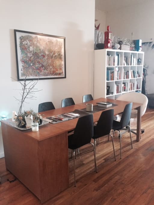 Dining table doubles as a huge workspace area & conference table