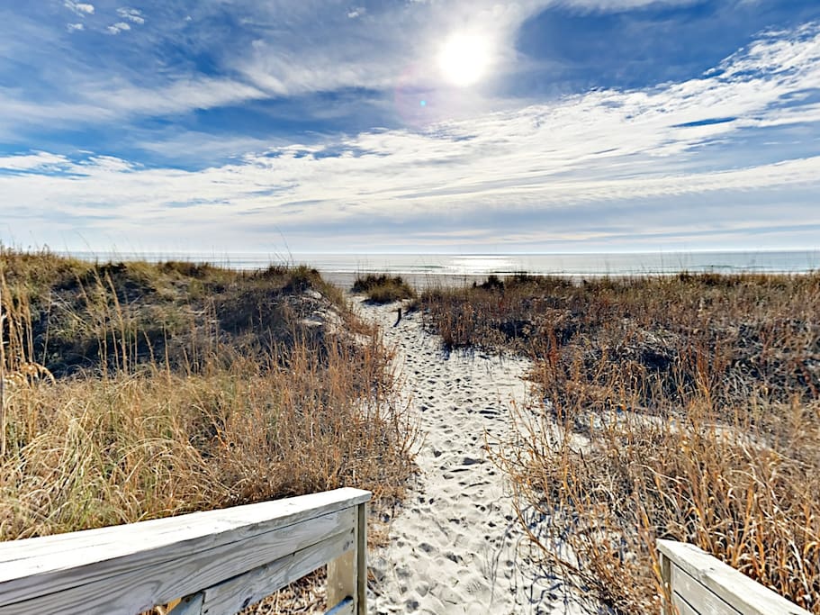 Follow a sandy dune line to the beachfront -- just steps from your door.