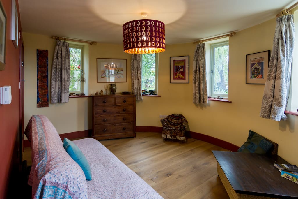the room with the bed put away