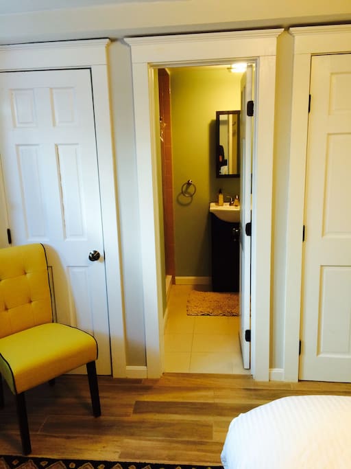 Bathroom, with a sitting chair.