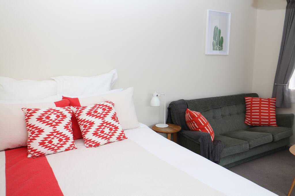 Comfortable queen bed with topper and quality linen.