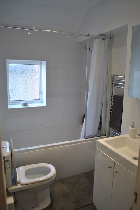 Private bathroom, fully equipped with power shower, full sized bath, toilet, sink and heated towel rail.