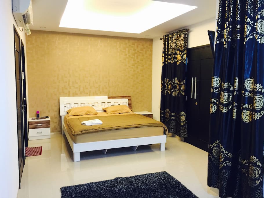 First bedroom with balcony and private bathroom