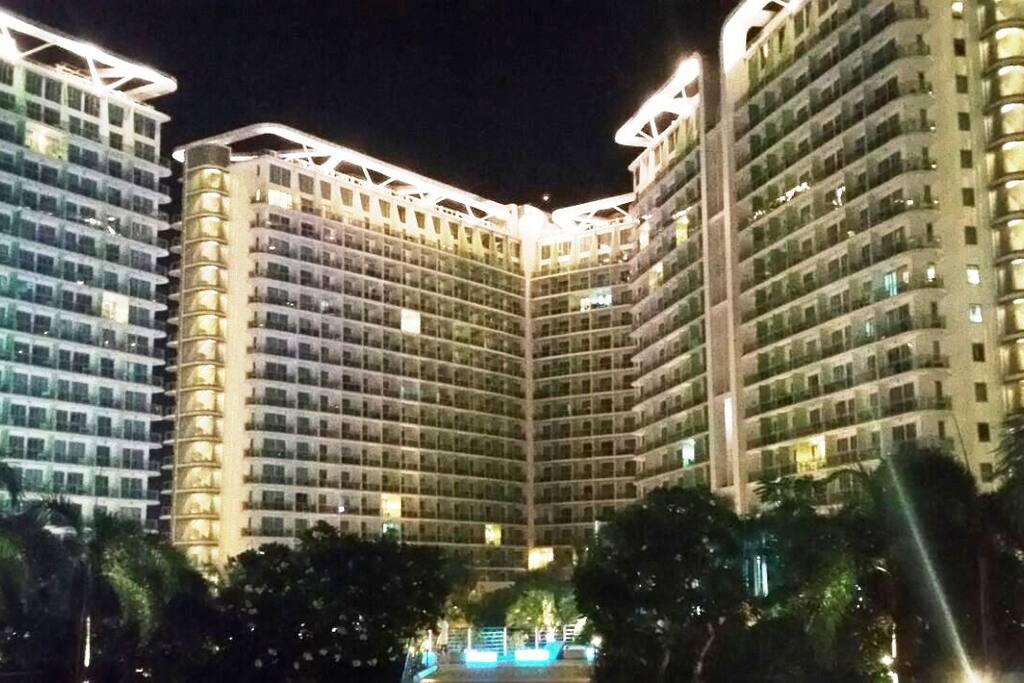 Azure Urban Resort Residences at night.