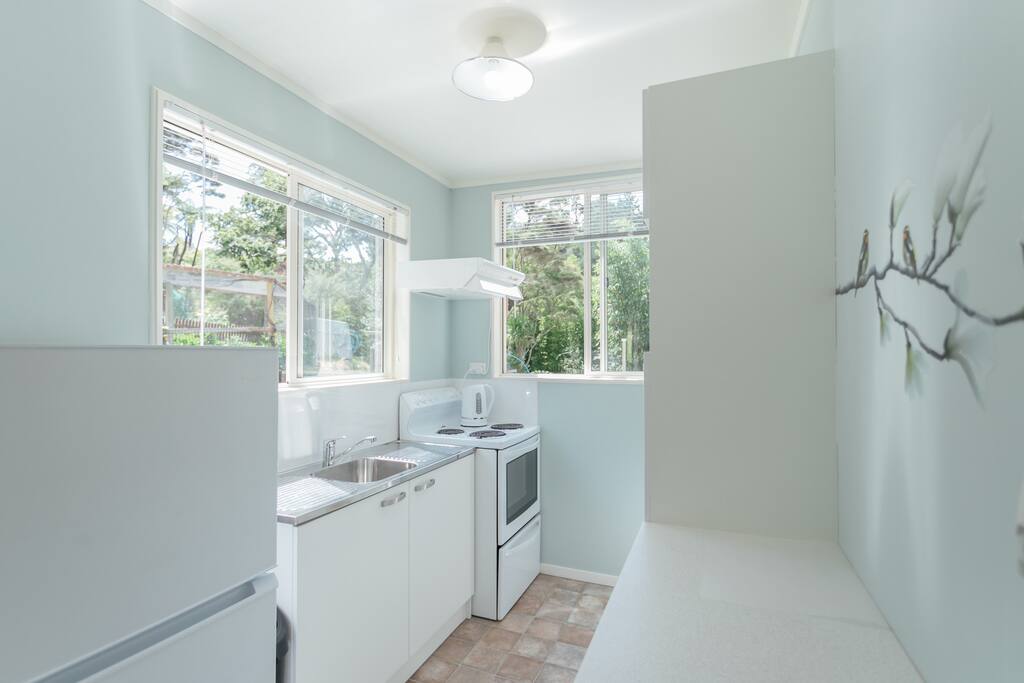 Fully equipped kitchen with microwave full size oven and fridge freezer.