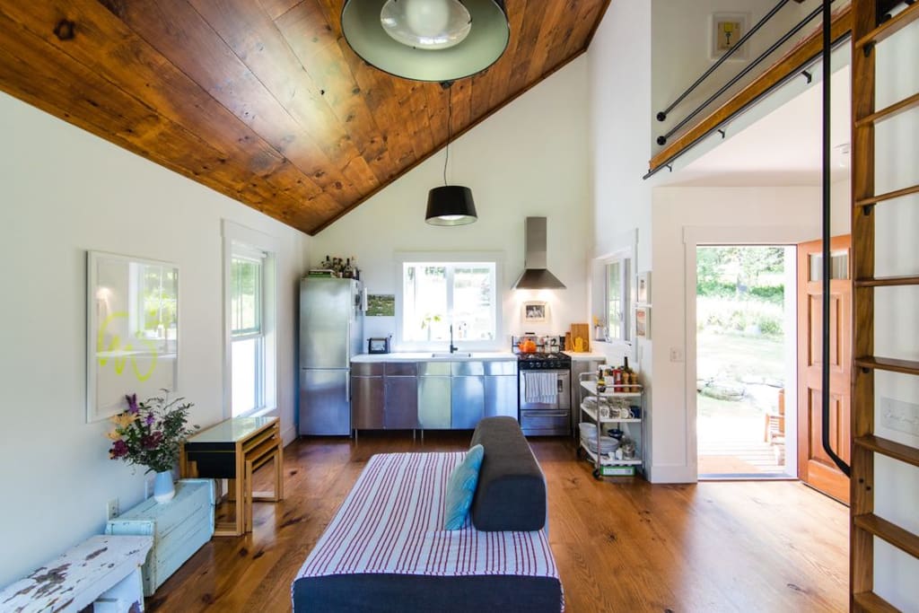 Living area and kitchen with all the cooking things you'll need.