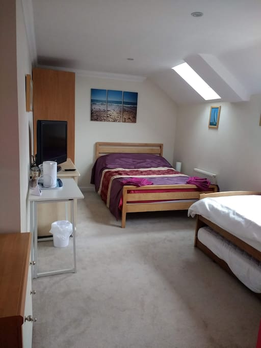 One double 2 single beds, wardrobe and 2 sets of chest of drawers, TV, tea making facilites.