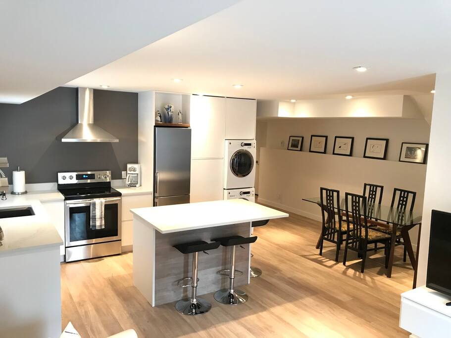 Complete kitchen and eating bar with seating for 3