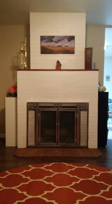 Living room fireplace available for guests enjoyment.