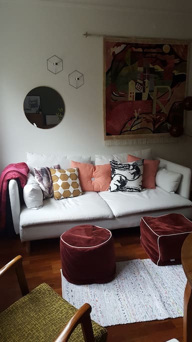 The living room has a comfortable sofa and sitting arrangements, TV with cable, a dining area and a fireplace.