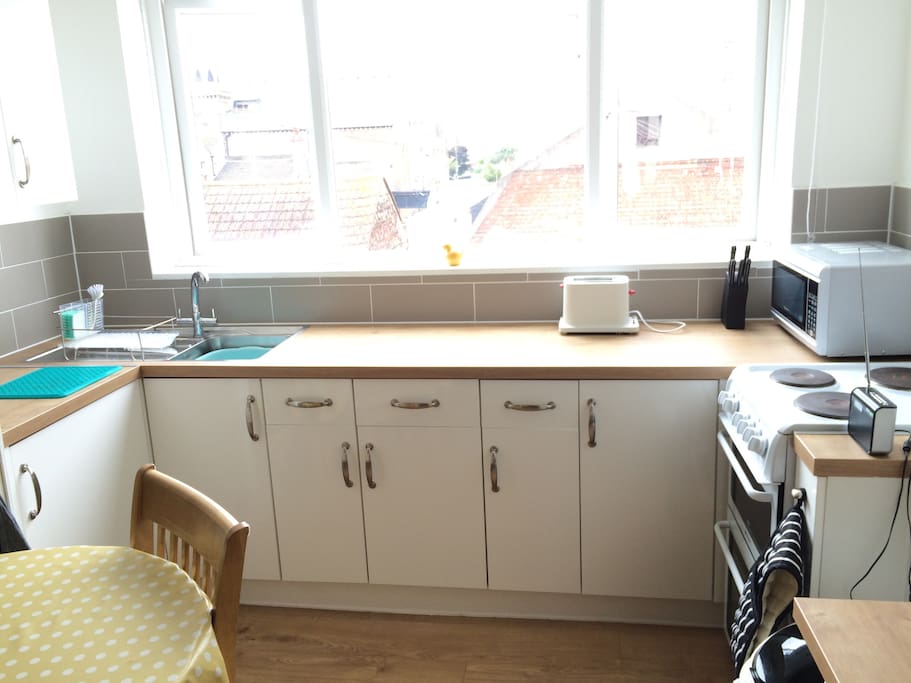 The kitchen is complete with pots and pans, cutlery and crockery, plus kitchen towel and cleaning supplies.