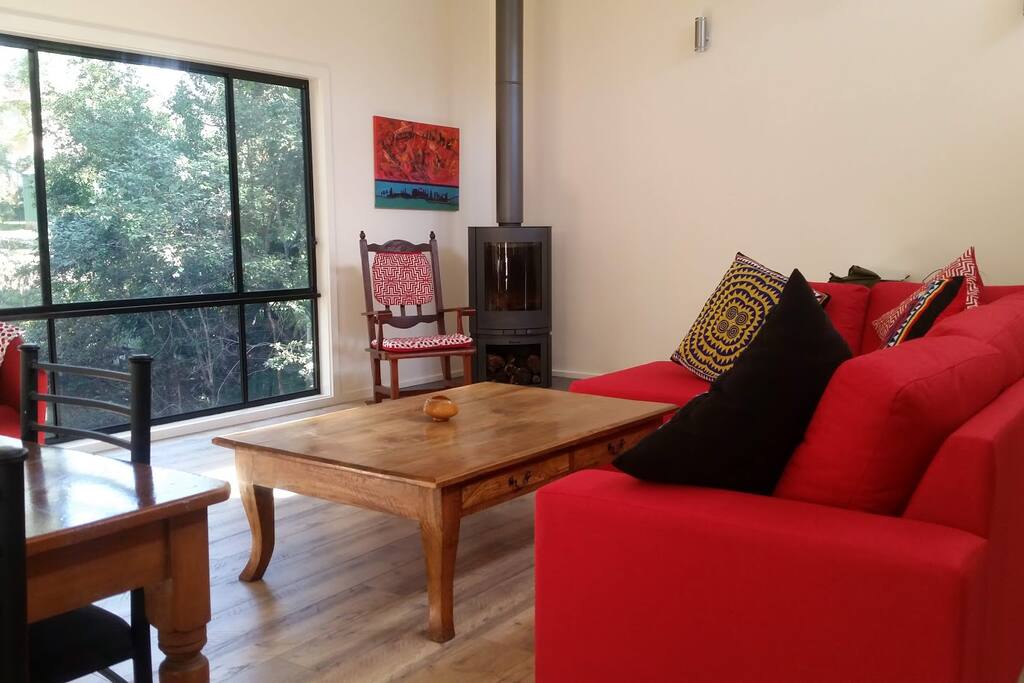 Entertainment - woodburner, birdlife or TV! Generous living space with solar passive design; keeps out the summer sun but lets it in in winter. Always light and airy.