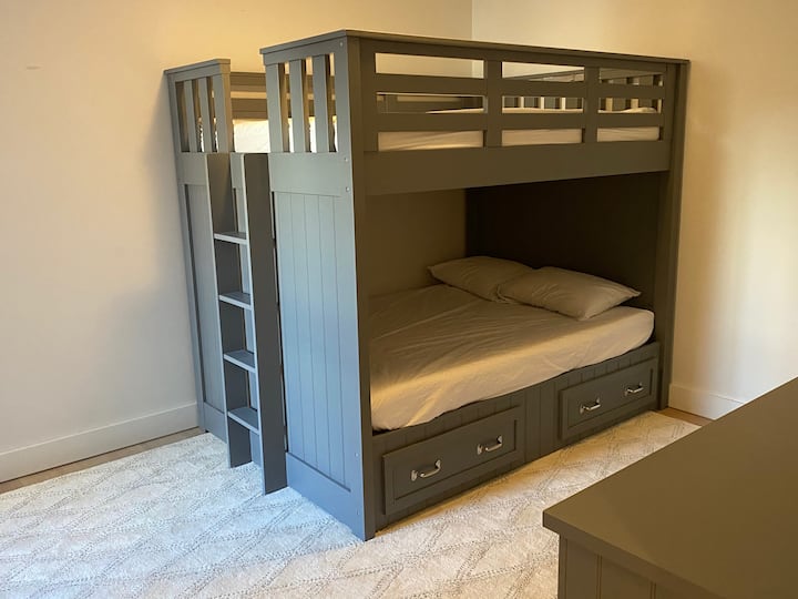 Full over full bunk room with en suite bathtub bathroom
