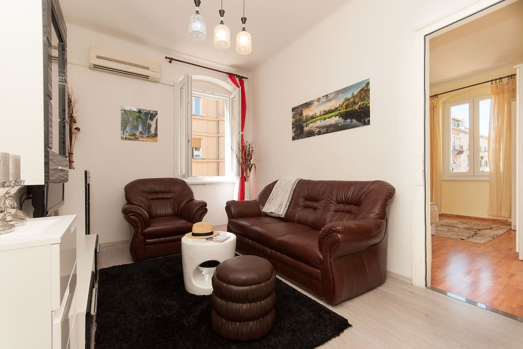 Relaxing living room with premium leather furniture and lots of light.