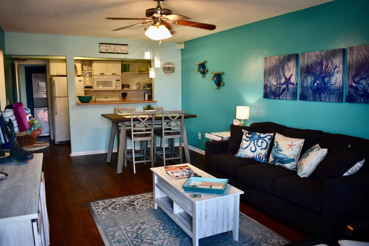View into Unit #2 Apartment from front door which accommodates up to 6 guests. Sofa has a pullout bed with memory foam mattress