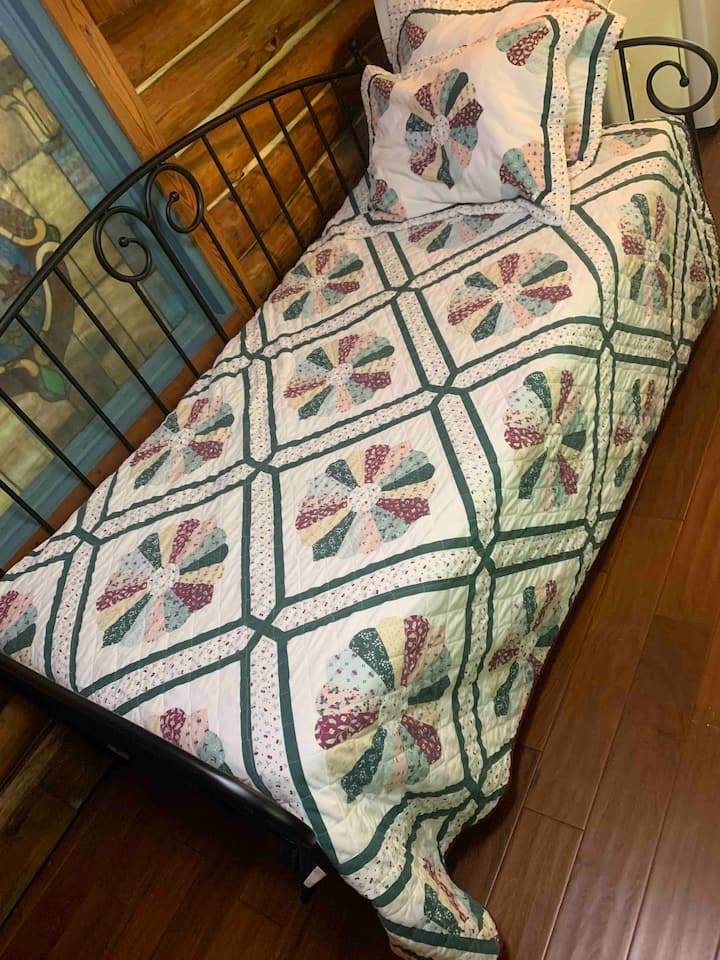 Twin bed with a trundle that slides out.