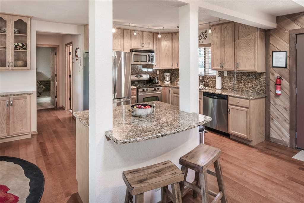 Kitchen Island - An open floor plan allows you and your party to gather and have a good time while preparing delicious meals.