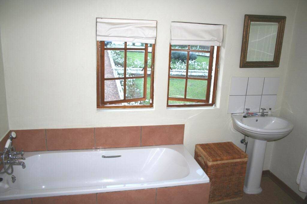 Bathroom with bath and shower