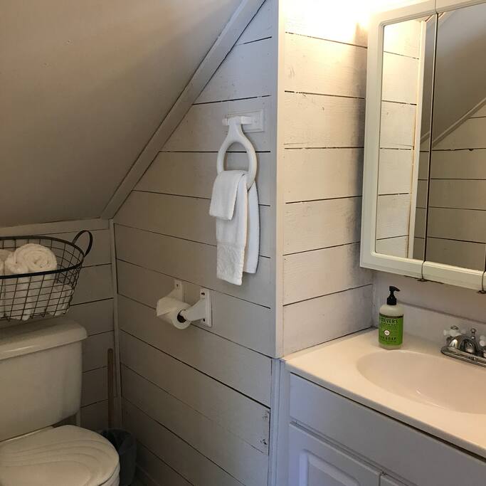 Ensuite bathroom has a shower and lots of fluffy towels