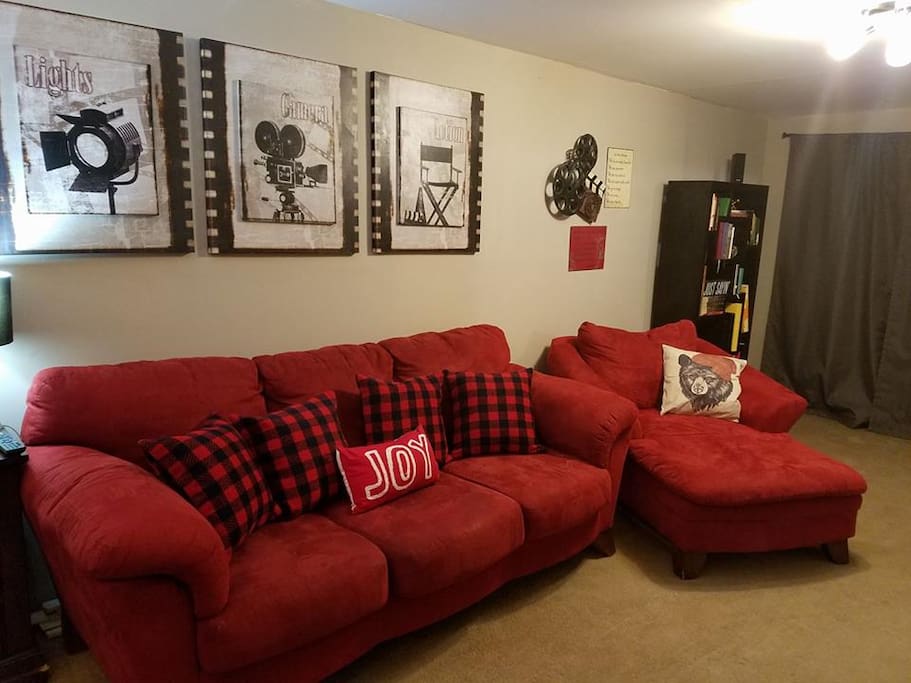 Living room set across from big flat screen tv that has netflix, hulu, amazon prime, and cable ready to go.