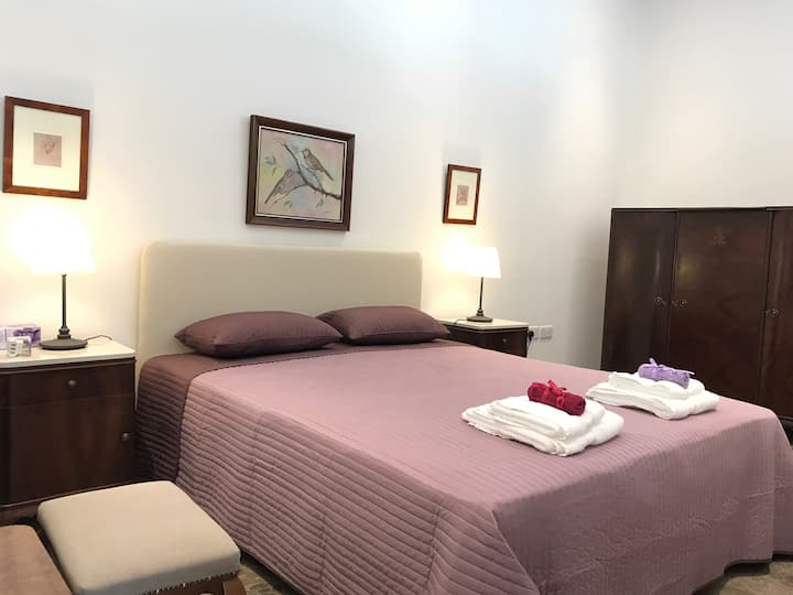 Separated by a wall, a unique Bedroom (brand new quality bed 1.60x2.00m), antique cupboard, commods and Makeup corner.