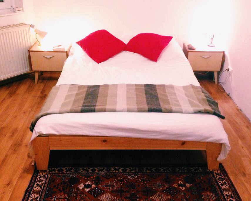 A large bed with comfortable cotton sheets, goose down pillows, and an extra blanket made of alpaca fur. You will sleep like a baby.
