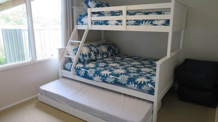 The third bedroom is the Kid's Room with double bed, single top bunk and single trundle, along with some bean bags.