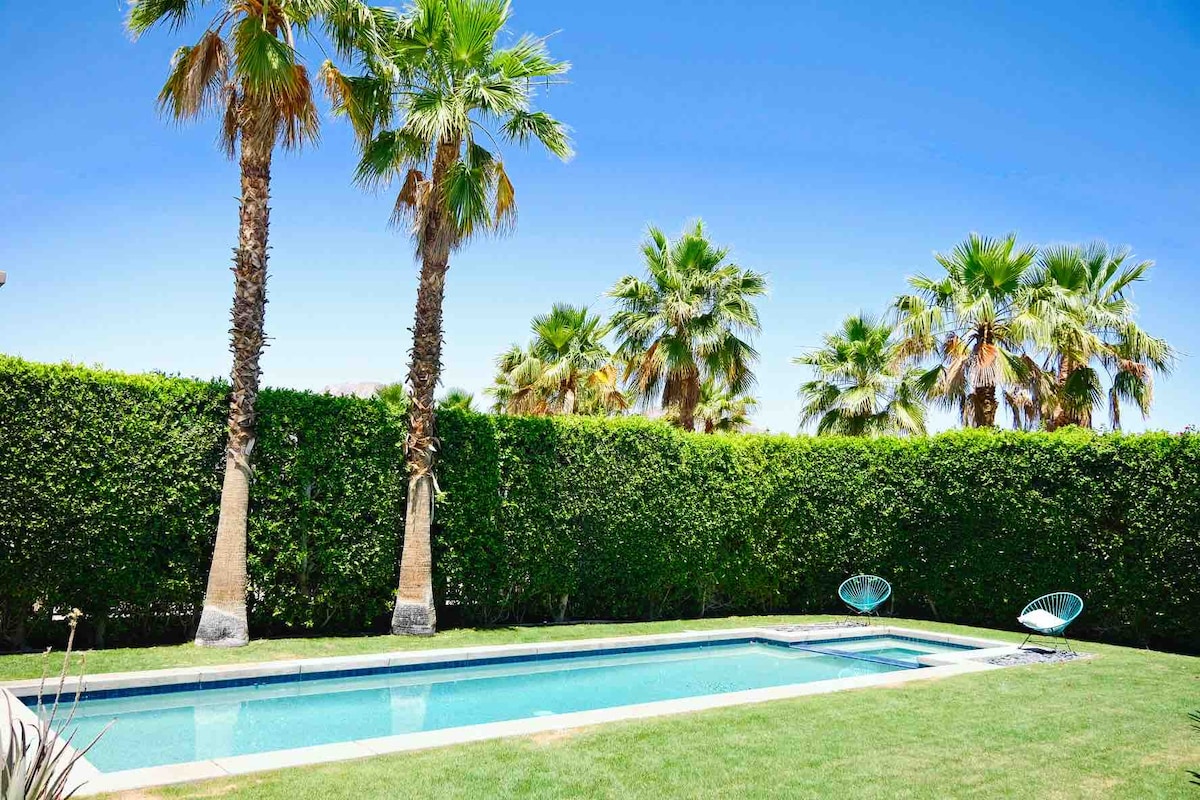 Pool and spa with palm trees
