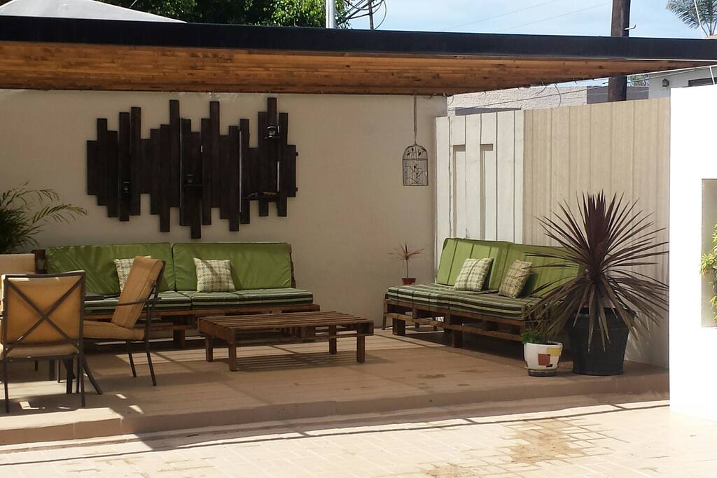 Relaxing outdoor lounge Area, with a ready to Grill BBQ.