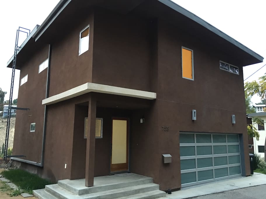 View of the front of the house. Front door and garage door can be seen in this photo.