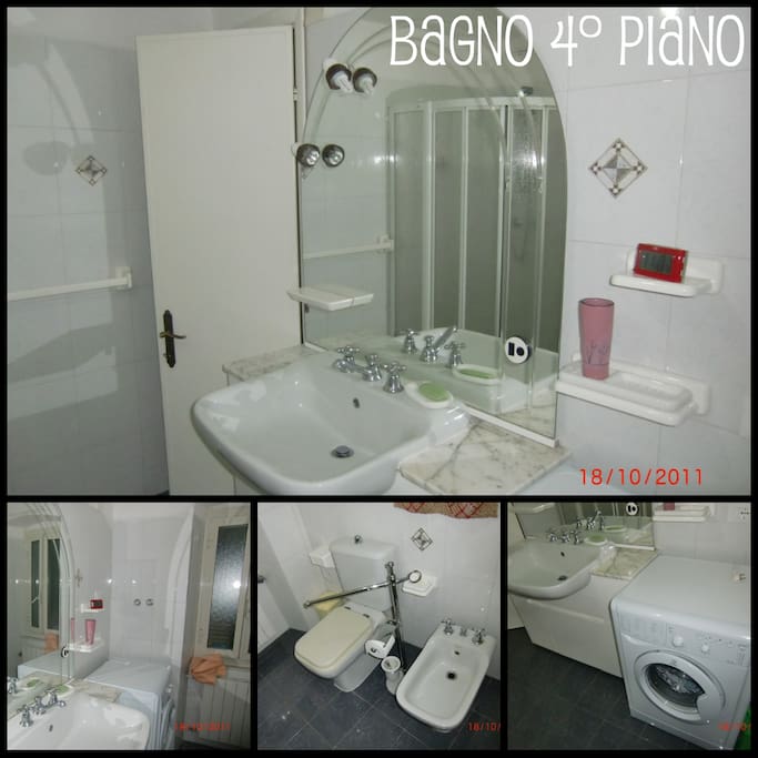 Bagno con doccia e lavatrice.