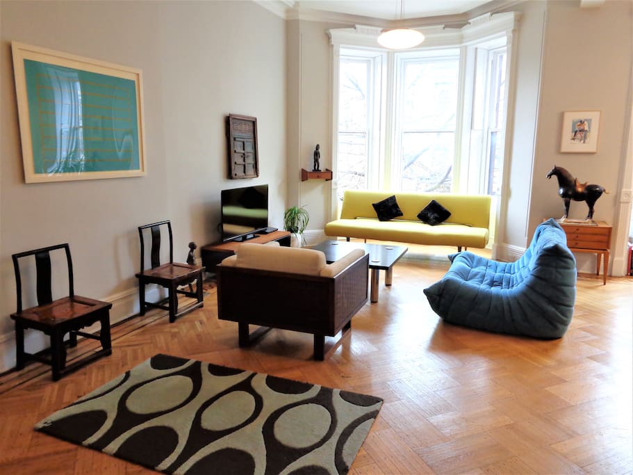 The living room has a full-size sofa bed, comfortably sleeping two additional guests.
