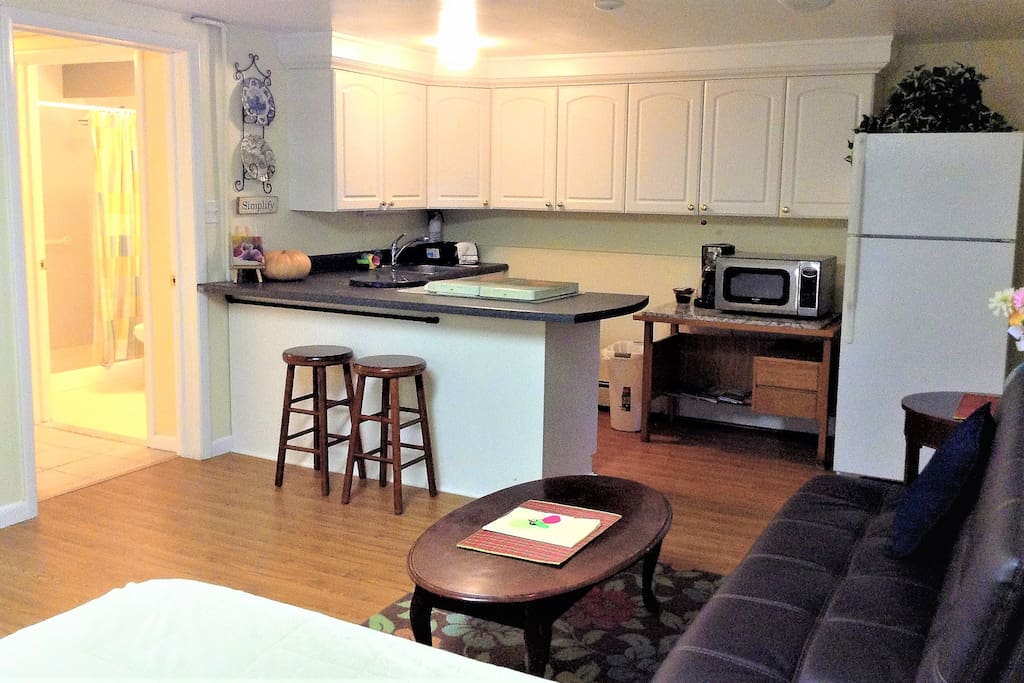 Full eat-in kitchen has refrigerator, micro oven, pots & dishes, silverware etc..