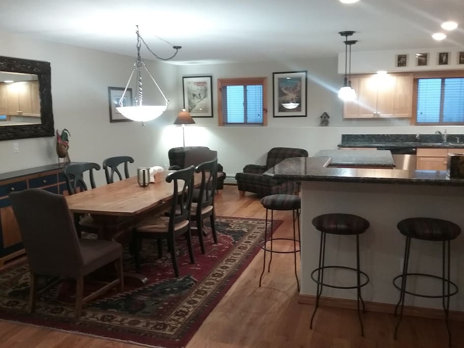 Dining for 6 at main table, plus seating for 5 more at breakfast bar.