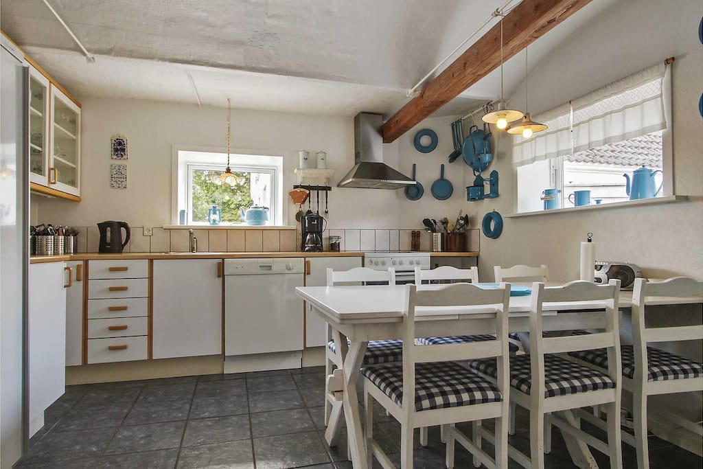 Shared fully equipped kitchen available to all guests, with coffee maker, dishwasher, microwave oven, fridge, stove top, oven etc