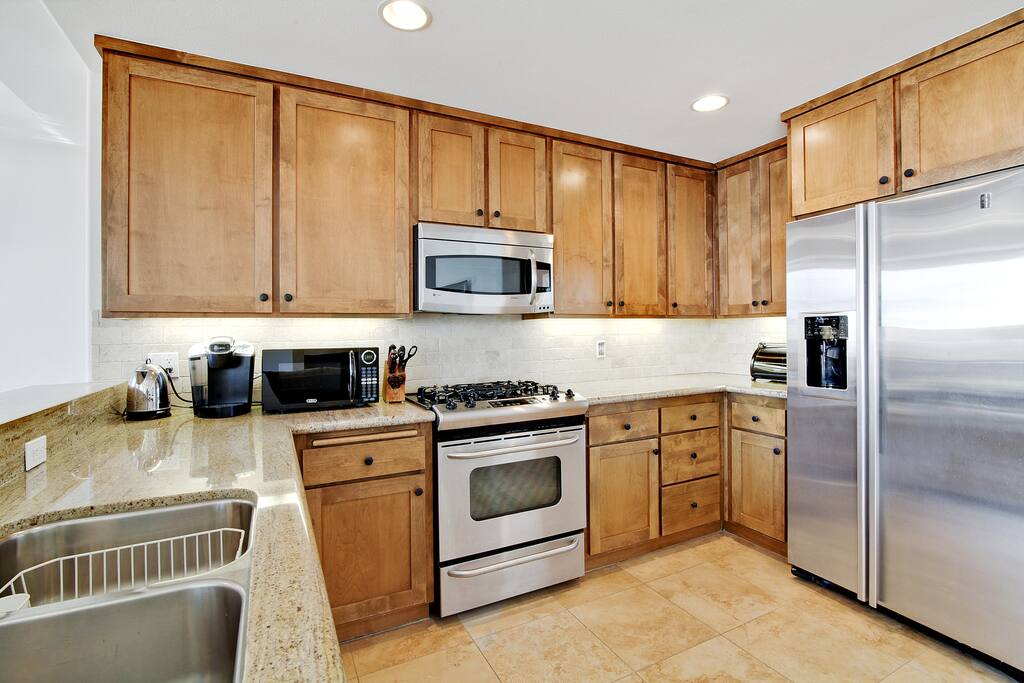 Appliances range from a dishwasher to Keurig in the sleek kitchen