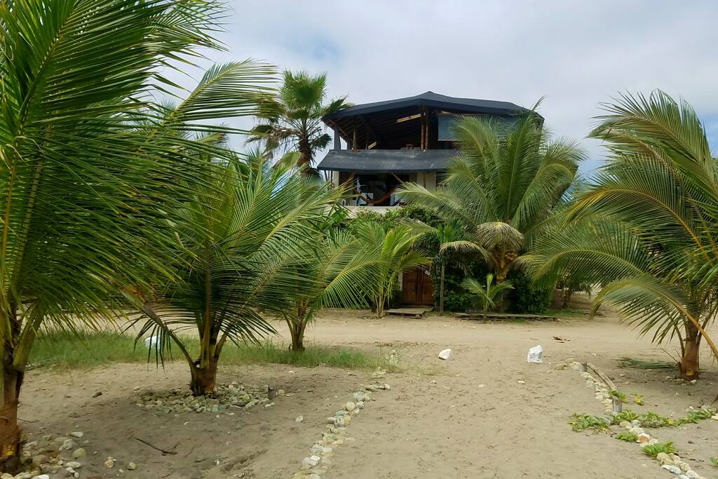View of La Casa hostel from the beach