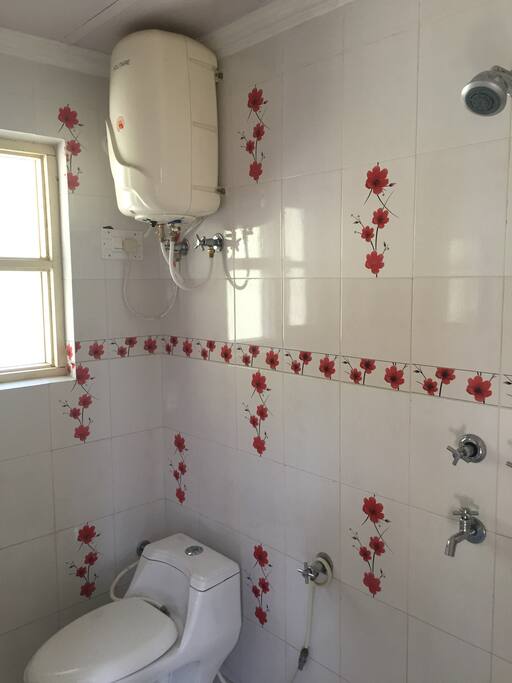 Bathroom with water heater.