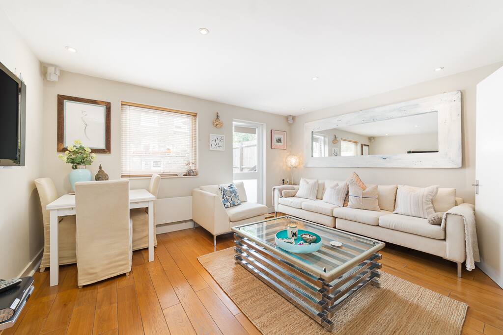 Open plan sitting room with dining area.